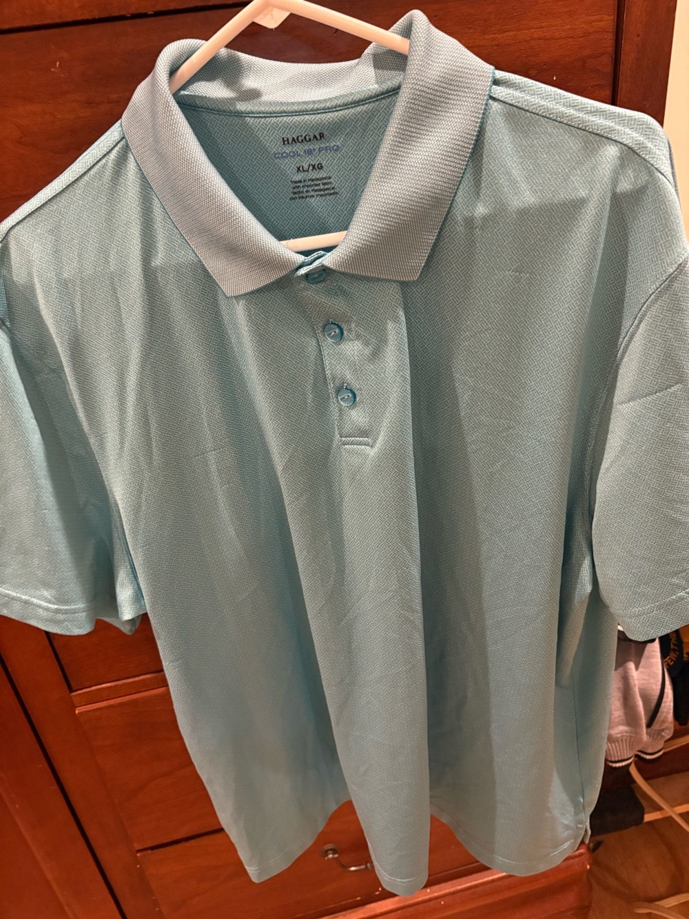 Teal men’s golf style shirt